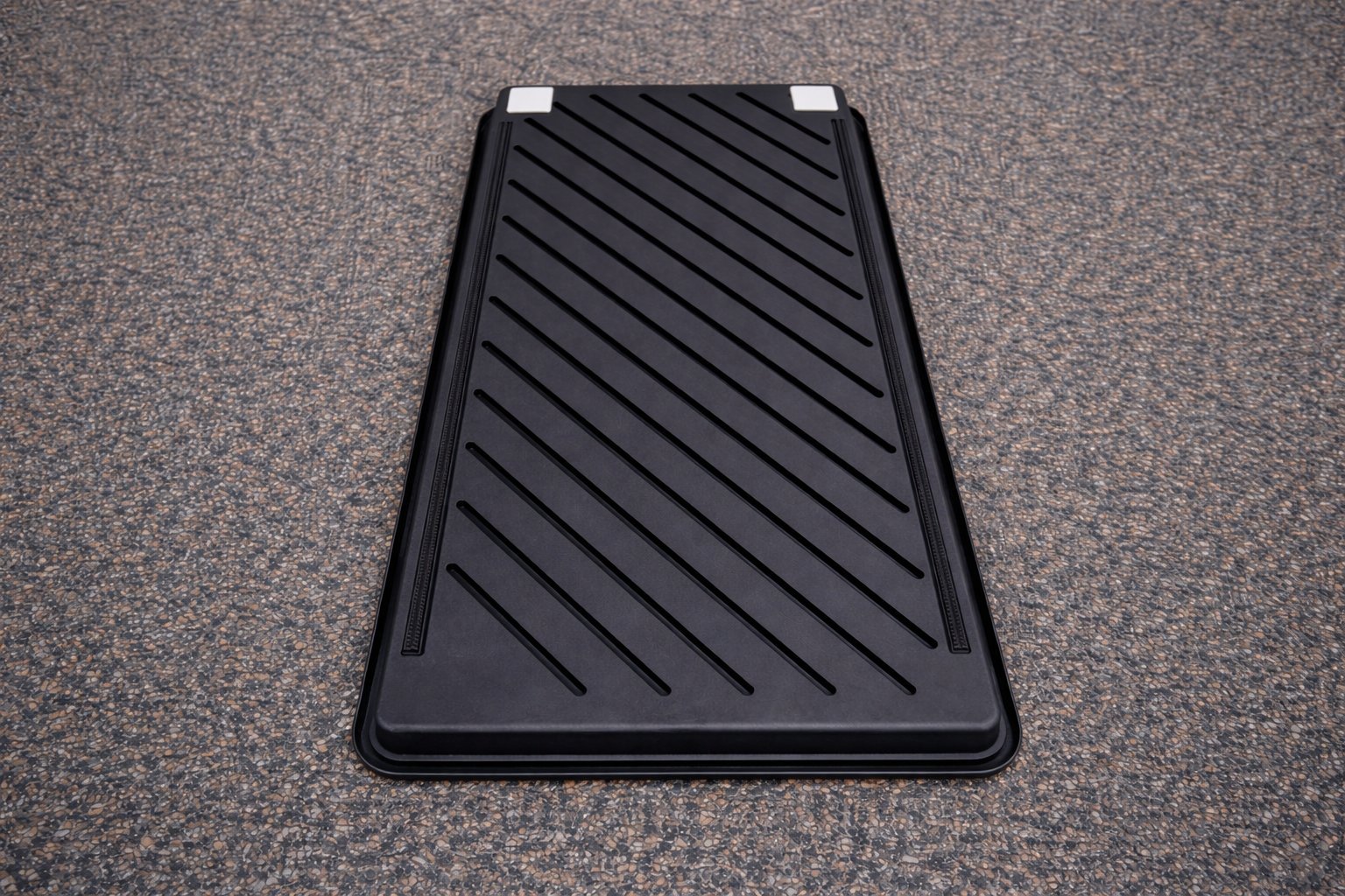 Bag Sled base mechanism showing glide tiles and rubber strips